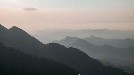 A Landscape panorama view of ocean and mountain with the beautiful sky. Taking photos during dusk at Jiufen Village.の写真素材