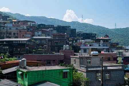 landscape view of JiuFen Village with mountain residental buildings and blue sky. Ruifang District, New Taipei City, Taiwanのeditorial素材