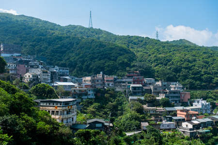 landscape view of JiuFen Village with mountain residental buildings and blue sky. Ruifang District, New Taipei City, Taiwanのeditorial素材