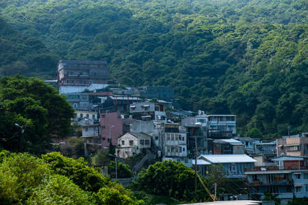 landscape view of JiuFen Village with mountain residental buildings and blue sky. Ruifang District, New Taipei City, Taiwanのeditorial素材