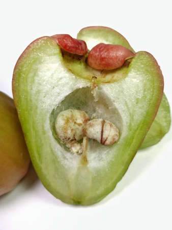 rose apple red The flesh is greenish-white, halved, grainy.の写真素材
