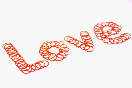 rubber bands arranged diagonally to form the word love