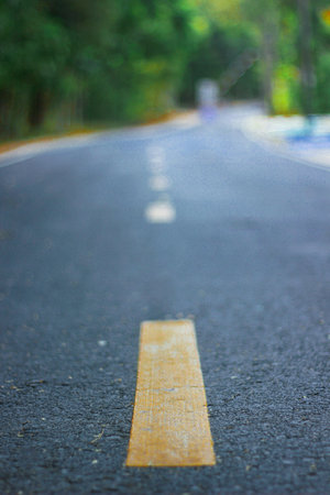 Yellow dotted line in the middle of the road.の写真素材