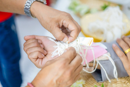 Thai Wedding Wrist Tying Ceremony with Sacred Thread