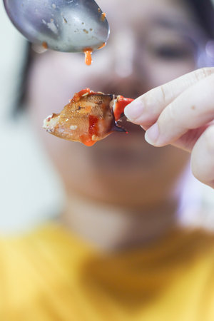 Dipping Sauce Dripping on Mud Crab Meatの写真素材