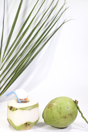 Young Coconut and a Fragrant Coconut Ready to Drink on a White Background