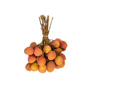 Lychees are bundled together in bunches for sale. White background.の写真素材