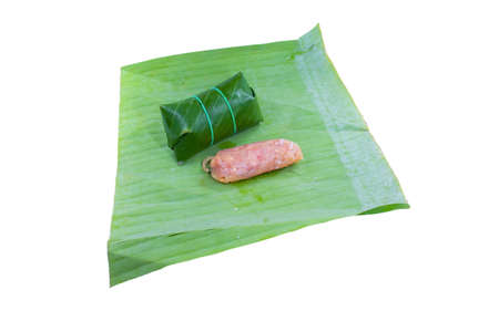 Marinated pork wrapped in banana leaves. Another way to preserve food.の写真素材