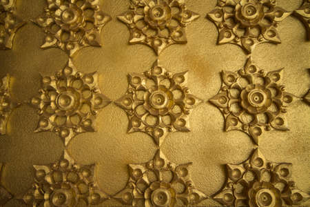 Walls made of gold inside Wat Chaimongkol Roi Et hold on Thailand.