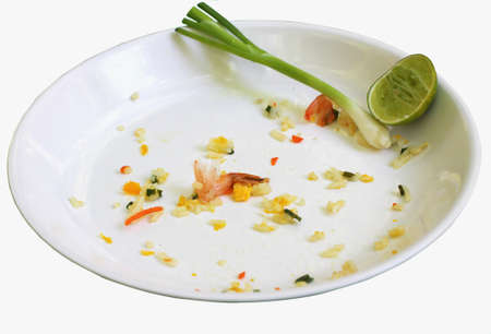 Dirty dishes, empty food isolated white backdrop.の写真素材