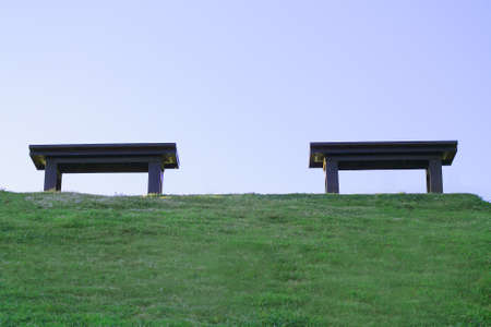 Two benches in the park.