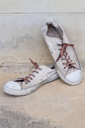 Old old sneakers on the floor