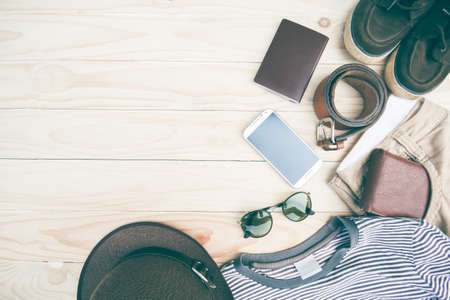 Casual clothing and accessories on the wooden background.の写真素材