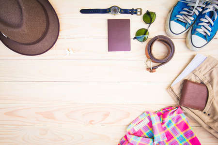 Casual clothing and accessories on the wooden background.の写真素材