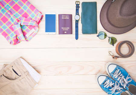 Casual clothing and accessories on the wooden background.の写真素材