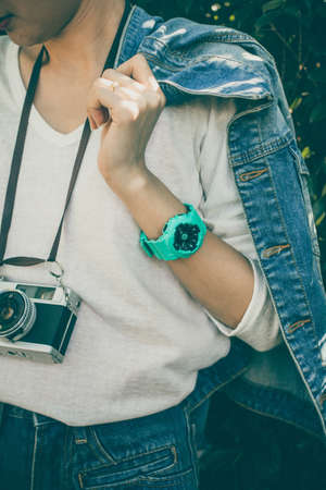 fashion clothes and vintage, vintage film camera and a light rainbow background.