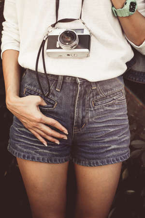 fashion clothes and vintage, vintage film camera and a light rainbow background.の写真素材