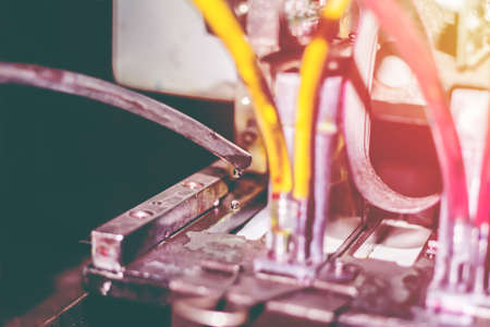 Close-up of drops liquid inkjet printers in large machines white sunset background