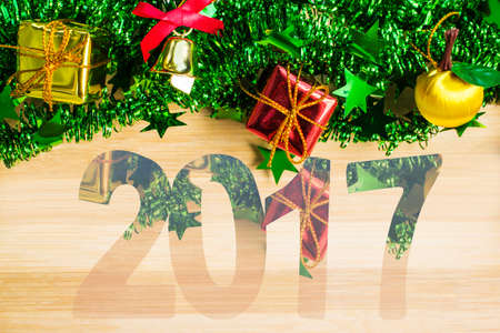 Christmas symbols colorful stars and with a wooden texture and happy New Year holiday backgroundの写真素材