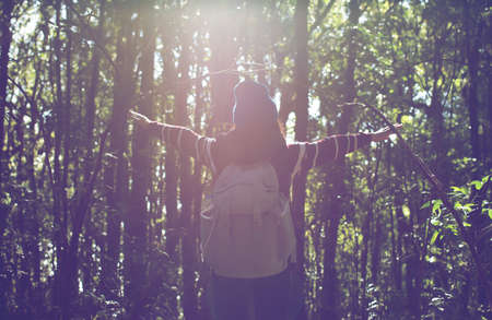 Women stand in the wild freedom sunset light.