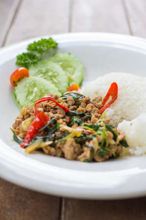 Rice with fried pork on the wood.の写真素材