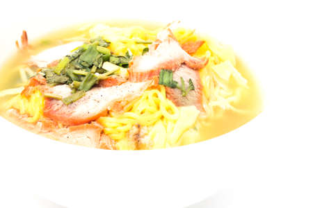 Yellow noodles on white background