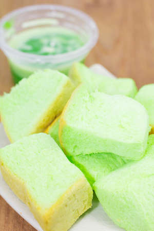 Pandan custard in a dish placed on the wood.の写真素材