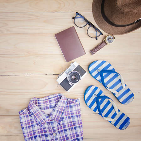 Casual clothing and accessories on the wooden background.の写真素材