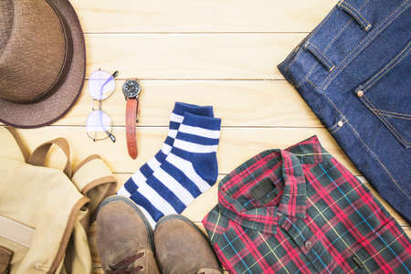 Clothing and apparel for men on a wooden background.の写真素材