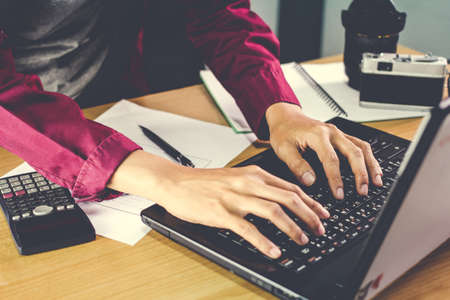Man work on the computer business concept Vintage tone.