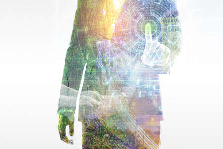 Double exposure. Close up young businessman touching opening data Information Technology Virtual Futuristic, with working on laptop and nature cityscapeの写真素材