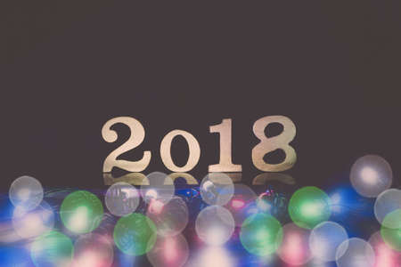 2018 Happy New Year background with  number symbols wood Beautiful colour bokehの写真素材