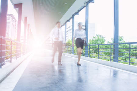 Businesspeople walking in the footpath, pronounced motion blurの写真素材