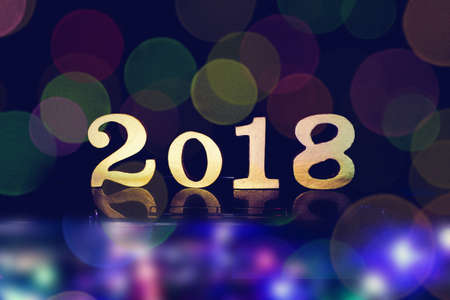 2018 Happy New Year background with  number symbols wood Beautiful colour bokehの写真素材