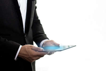 Selective Focus,Close up business man holding tablet on white background,Leave blank space for the text.の写真素材