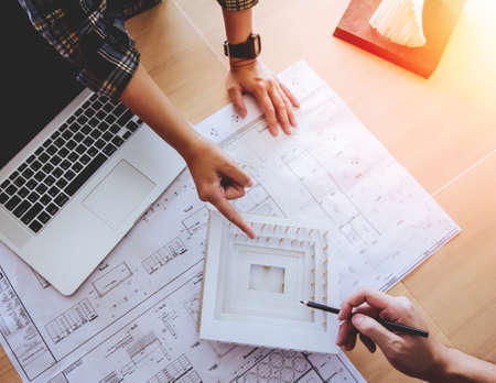 Top view,Concept architects,engineer holding pen pointing equipment architects On the desk with a...