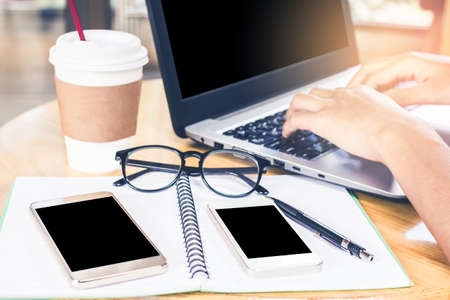 Close up. Man Working on laptop connecting networking Concept,With sunset,Selective Focus.の写真素材