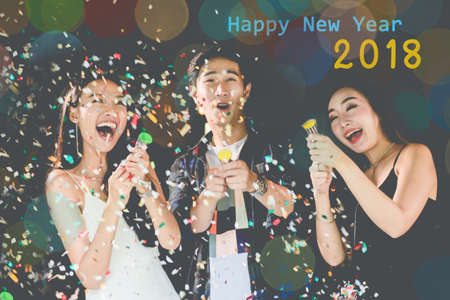 celebration party group of Two asian young man and women people holding confetti happy and funny conceptの写真素材
