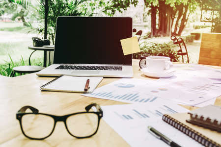 laptop on wooden  desktop in modern office with accessories,Copy space for your text,Holidays and の写真素材