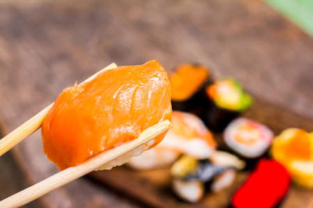 Top view,Sushi Set sashimi and sushi rolls served on wood slate.Copy space for your text.の写真素材