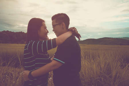 Asian,Romantic couple or Homosexuality, female love hug on the rice field with sunset, Valentine's...