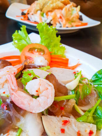 Thai cuisine spicy pork salad or Pork salad spicy ,shrimp, lettuce, chili tasty, thai food on table.の写真素材