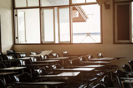 Classroom in background without ,No student or teacher . with Sunset limelight near window.の写真素材