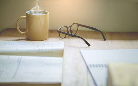 Coffee cups and glasses  on the table With Sunset Light Background, Selective focusの写真素材