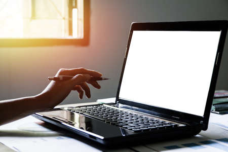 Business man work meeting point to discuss the graph up and down of economy and work on laptop.