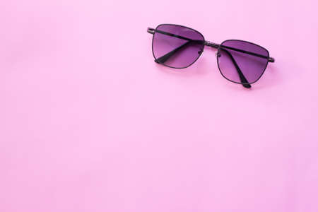 Black glasses , Minimal style layout Leave blank for the text. On a pastel pink backgroundの写真素材