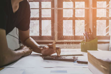 account working calculator, profit or graph economy on tables in office at home, top view mock-upの写真素材