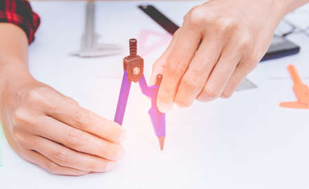 architectural projects office working with blueprints.Selective focus.Vintage tone with sunset background.の写真素材