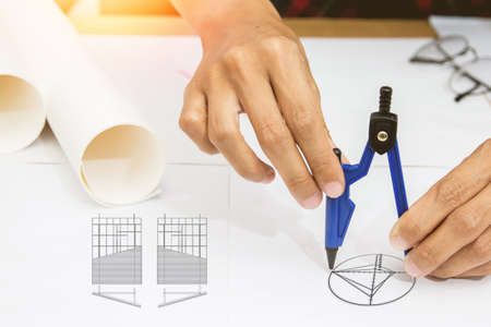 architectural projects office working with blueprints.Selective focus.Vintage tone with sunset background.の写真素材