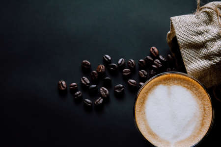 Latte art , with Roasted coffee on black background in the morning top viewの写真素材
